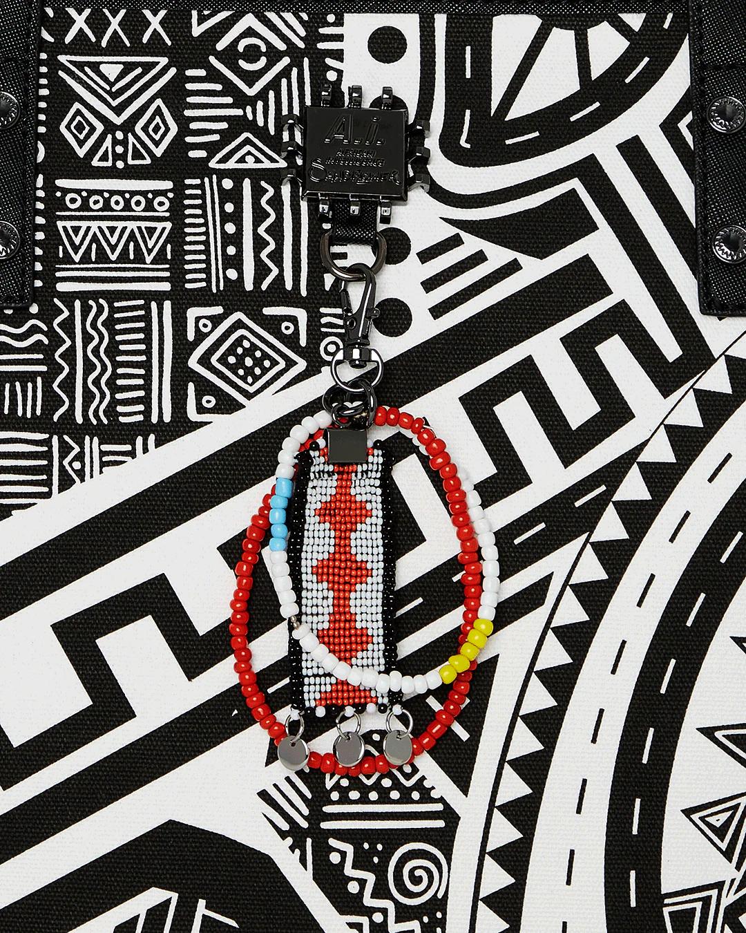 Sprayground Essential | A.I. AFRICAN INTELLIGENCE THE SKYHAWK WING TOTE - SANDFLOWER COLLAB