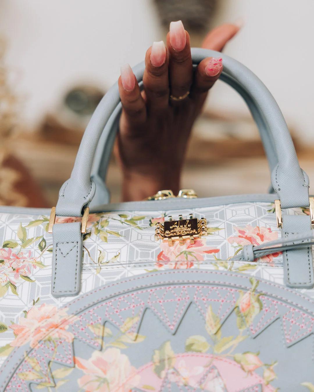 Sprayground Trending | A.I. AFRICAN INTELLIGENCE ELEGANT ENERGY MINI DUFFLE - SANDFLOWER COLL