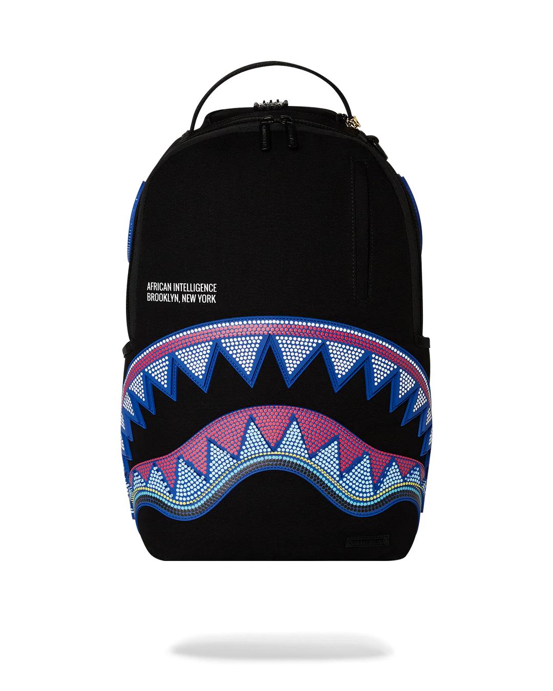Sprayground Classic | A.I. AFRICAN INTELLIGENCE BORN AND RAISED BACKPACK - SANDFLOWER COLLAB