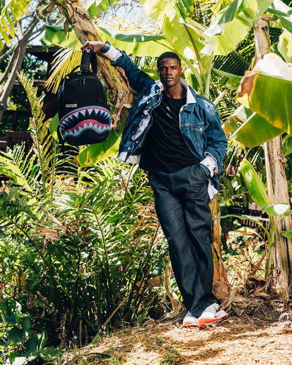 Sprayground Classic | A.I. AFRICAN INTELLIGENCE BORN AND RAISED BACKPACK - SANDFLOWER COLLAB