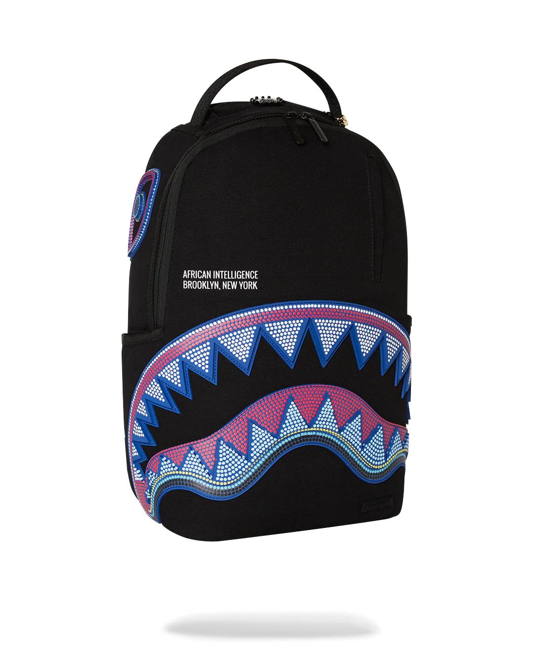 Sprayground Classic | A.I. AFRICAN INTELLIGENCE BORN AND RAISED BACKPACK - SANDFLOWER COLLAB