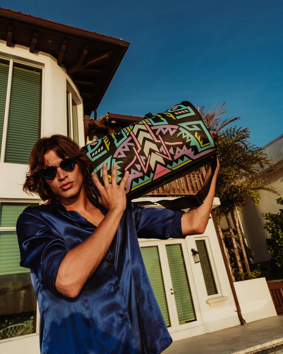Sprayground Signature | A.I. PATH TO THE FUTURE III DUFFLE - SANDFLOWER COLLAB (GLOW IN THE DA