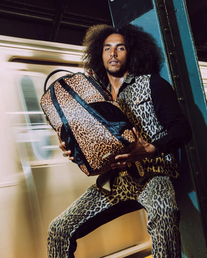 Sprayground Essential | AFRICAN INTELLIGENCE 9 COURAGE LIVES ON BACKPACK - SANDFLOWER COLLAB