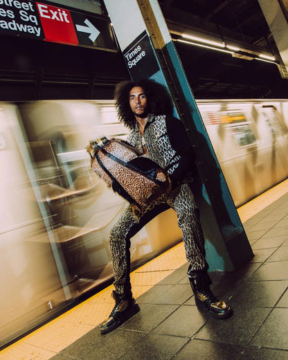 Sprayground Essential | AFRICAN INTELLIGENCE 9 COURAGE LIVES ON BACKPACK - SANDFLOWER COLLAB