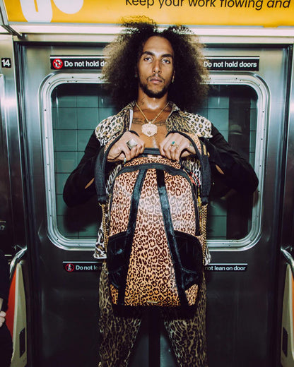 Sprayground Essential | AFRICAN INTELLIGENCE 9 COURAGE LIVES ON BACKPACK - SANDFLOWER COLLAB