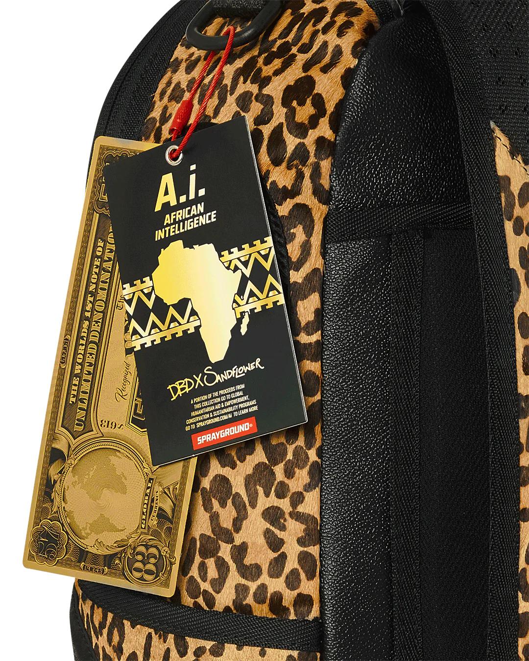 Sprayground Essential | AFRICAN INTELLIGENCE 9 COURAGE LIVES ON BACKPACK - SANDFLOWER COLLAB