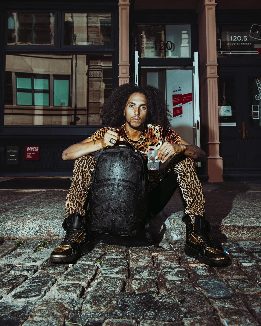 Sprayground Premium | AFRICAN INTELLIGENCE 9 APEX GENIUS BACKPACK - SANDFLOWER COLLAB