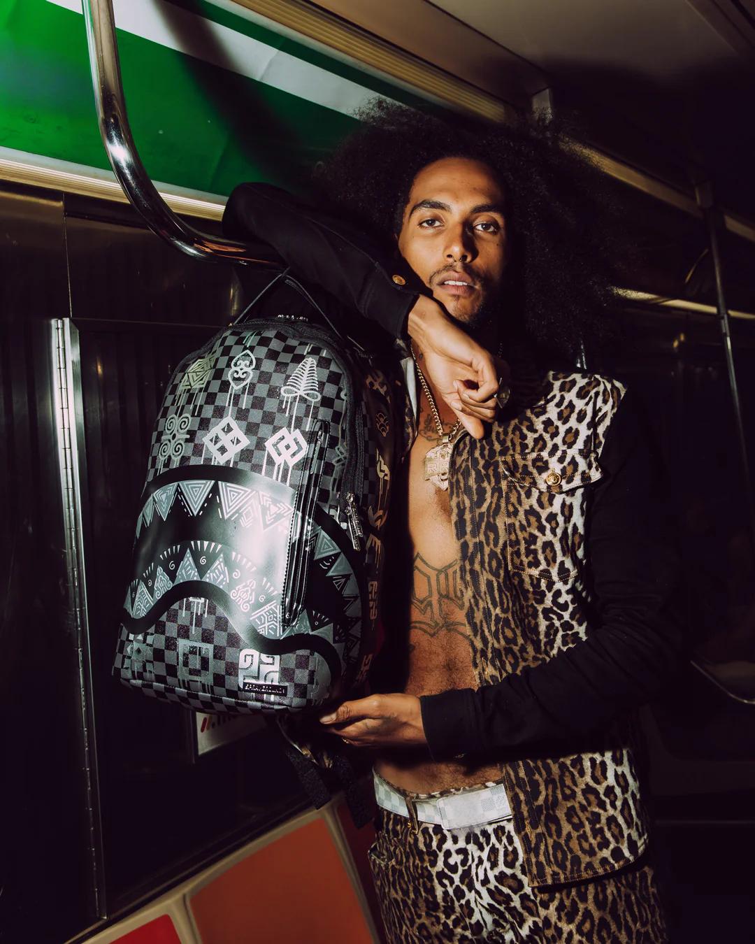 Sprayground New | AFRICAN INTELLIGENCE 9 POWER GLYPHICS BACKPACK - SANDFLOWER COLLAB