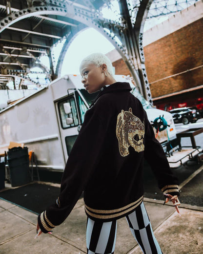 Sprayground Featured | A.I.9 AFRICAN INTELLIGENCE GUILDED LEOPARD - SANDFLOWER COLLAB VARSITY