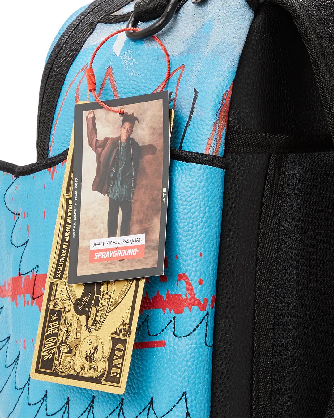 Sprayground Essential | OFFICIAL BASQUIAT UNTITLED (FALLEN ANGEL) 1981 WING BACKPACK (DLXV)