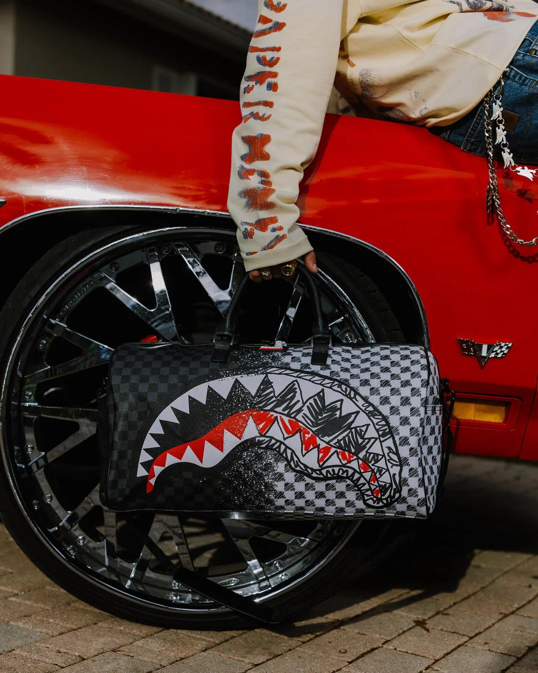 Sprayground Trending | SCRIBBLE DRIBBLE CHECK DUFFLE
