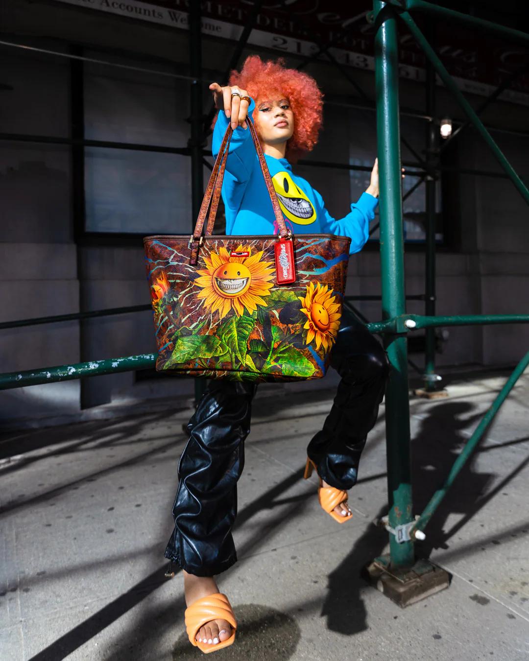 Sprayground Signature | SUNFLOWER GRIN RON ENGLISH COLLAB TOTE
