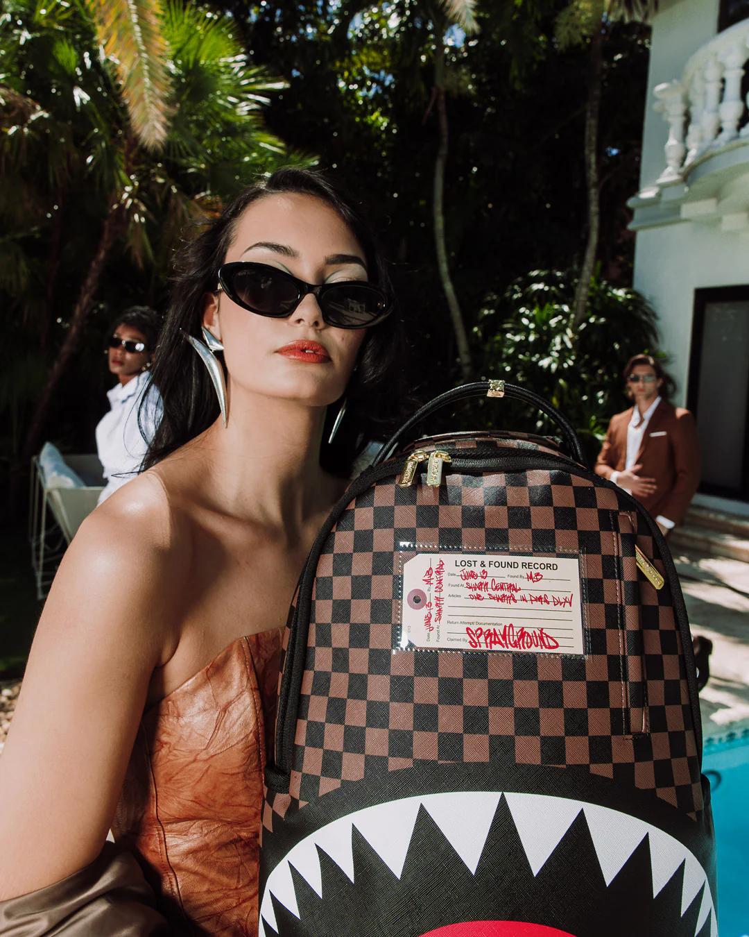 Sprayground Best Seller | SHARKS IN PARIS LOST & FOUND BACKPACK