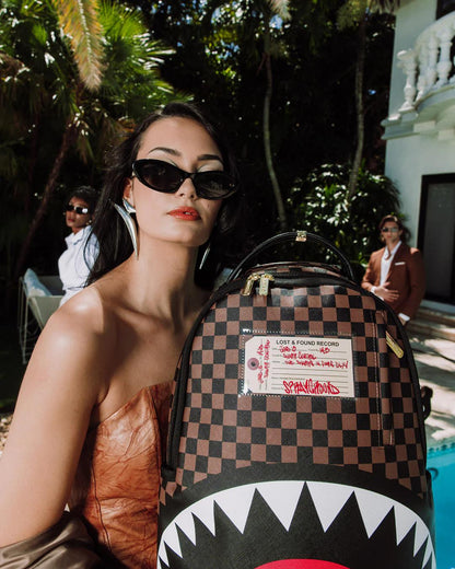 Sprayground Best Seller | SHARKS IN PARIS LOST & FOUND BACKPACK