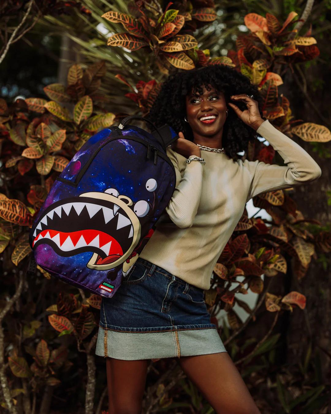 Sprayground Best Seller | FUTURAMA NIBBLER EAT SHARK DLXR BACKPACK