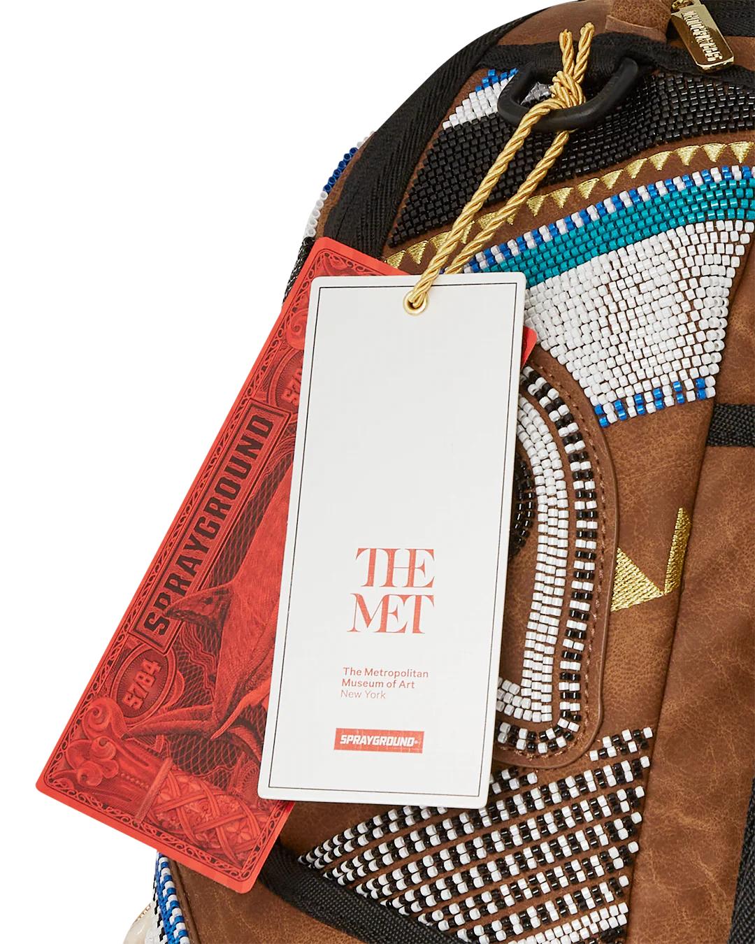 Sprayground Trending | THE MET KUBA KINGDOM HEADDRESS BACKPACK