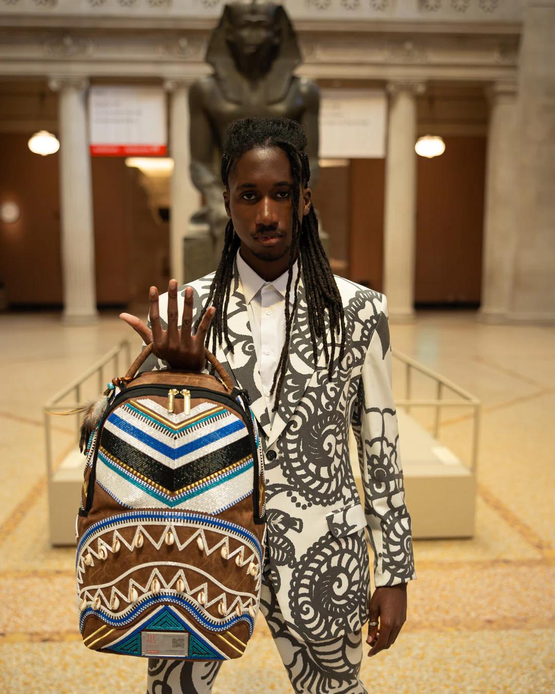 Sprayground Trending | THE MET KUBA KINGDOM HEADDRESS BACKPACK